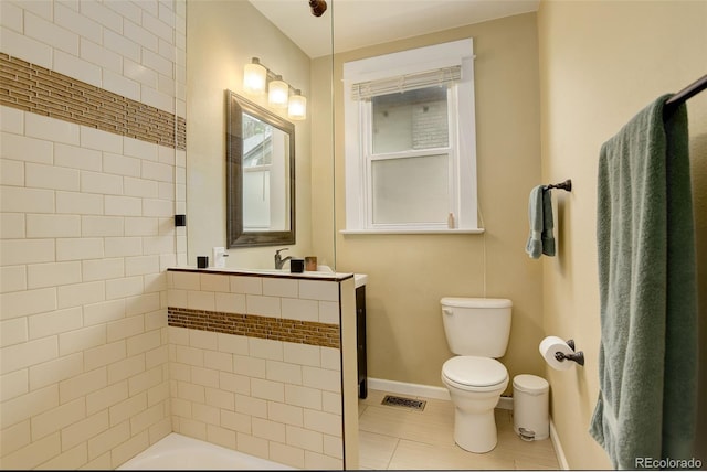 848 Harrison St, Denver, CO 80206 - full bathroom featuring toilet, vanity, tile patterned flooring, baseboards, and shower / bath combination