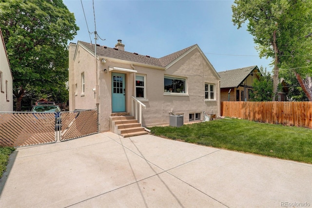 848 Harrison St, Denver, CO 80206 - view of front of home featuring stucco siding, a chimney, and central air condition unit