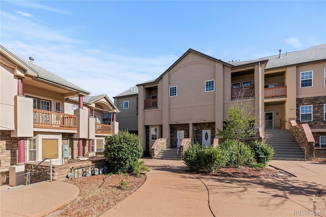 10578 E Jewell Ave, Aurora, CO 80012 - view of front facade featuring stucco siding and stone siding