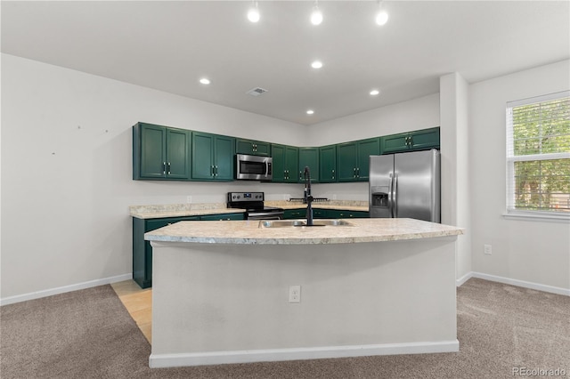 10578 E Jewell Ave, Aurora, CO 80012 - kitchen featuring appliances with stainless steel finishes, light countertops, green cabinets, light colored carpet, and recessed lighting