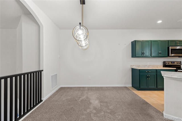 10578 E Jewell Ave, Aurora, CO 80012 - kitchen with green cabinetry, stainless steel appliances, light countertops, light colored carpet, and recessed lighting