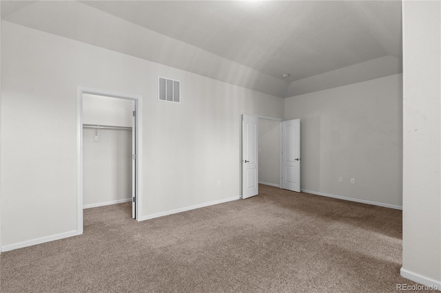 10578 E Jewell Ave, Aurora, CO 80012 - unfurnished bedroom with carpet, a walk in closet, and baseboards