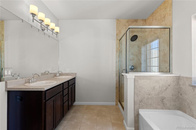 10578 E Jewell Ave, Aurora, CO 80012 - full bathroom with a garden tub, a shower stall, tile patterned flooring, double vanity, and baseboards
