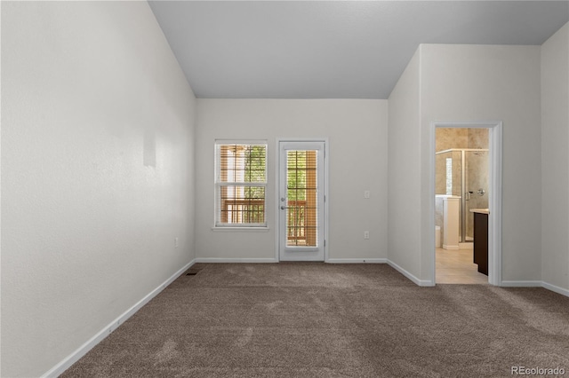 10578 E Jewell Ave, Aurora, CO 80012 - unfurnished bedroom featuring carpet flooring, baseboards, access to exterior, and ensuite bath