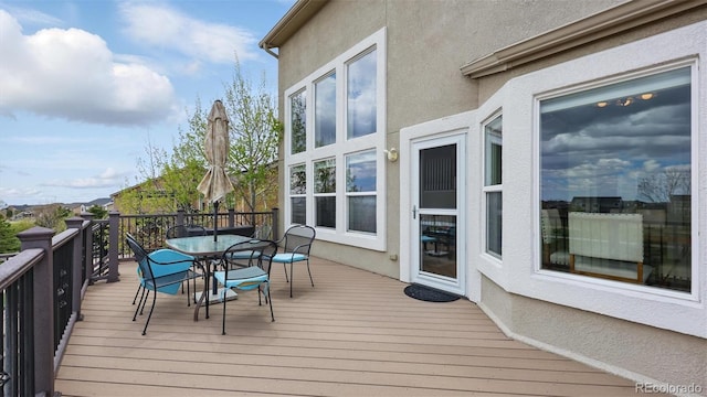 11818 Rio Secco Rd, Peyton, CO 80831 - wooden terrace featuring outdoor dining space