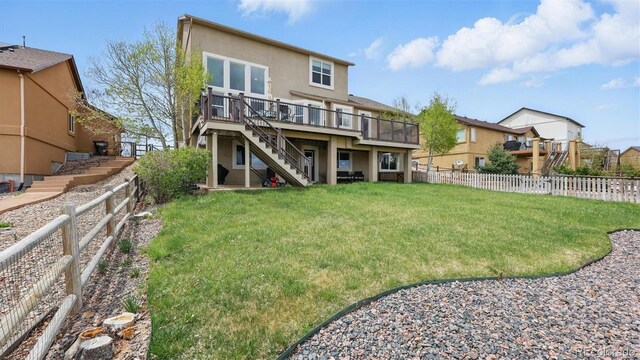 11818 Rio Secco Rd, Peyton, CO 80831 - rear view of house with stairway, a wooden deck, stucco siding, and a residential view