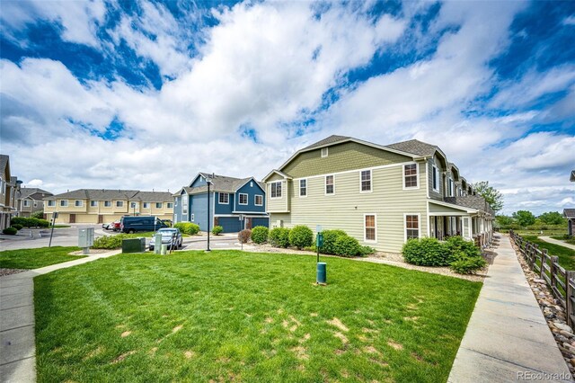 15955 E Geddes Dr Unit 55, Aurora, CO 80016 - view of side of property featuring a yard and a residential view