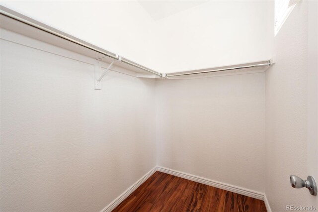 15955 E Geddes Dr Unit 55, Aurora, CO 80016 - spacious closet featuring dark wood-style flooring
