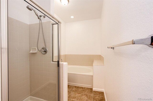 15955 E Geddes Dr Unit 55, Aurora, CO 80016 - bathroom with a shower stall, a garden tub, and tile patterned floors