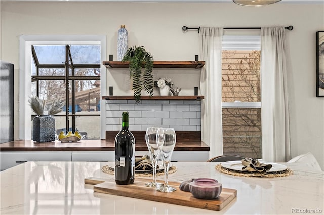 interior details featuring decorative backsplash