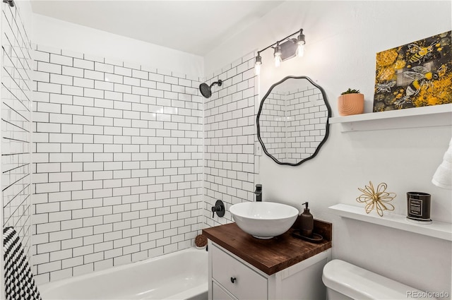 bathroom with vanity, toilet, and shower / bathtub combination