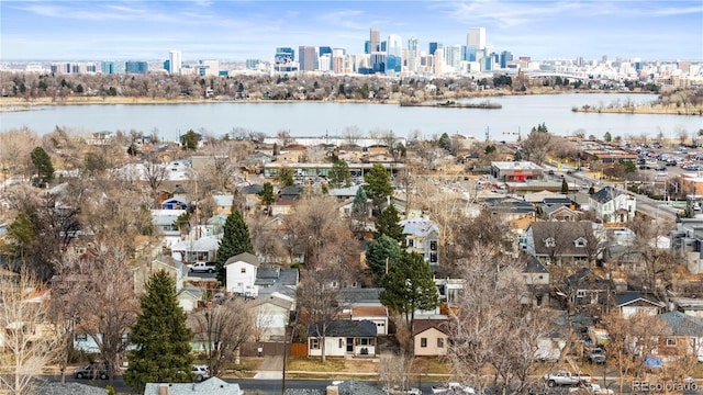 birds eye view of property featuring a view of city and a water view