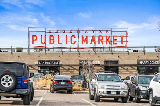 view of property featuring uncovered parking