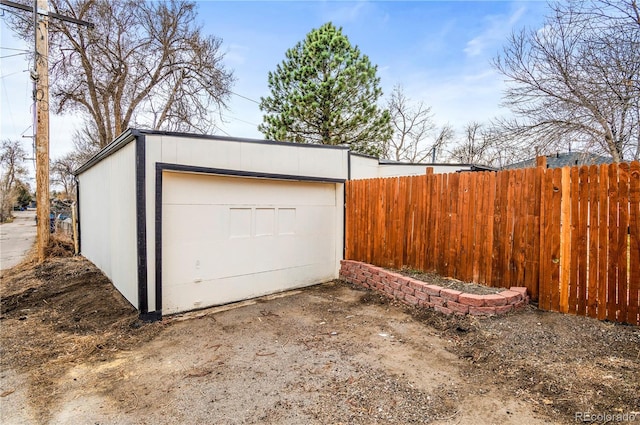 garage featuring fence