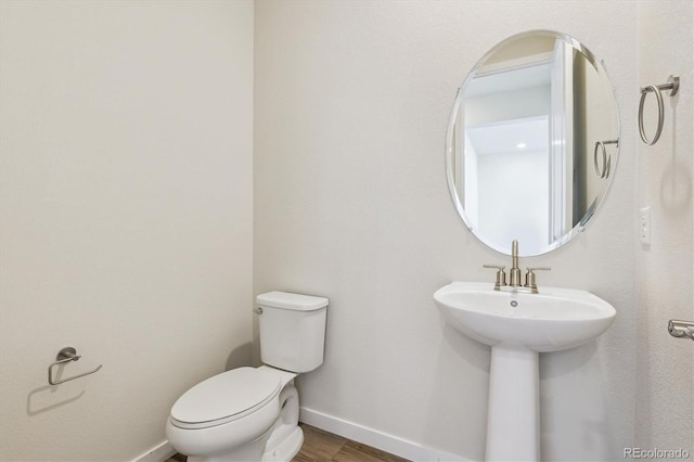 bathroom with toilet and sink