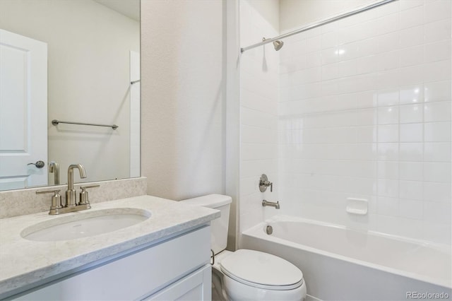 full bathroom featuring vanity, bathtub / shower combination, and toilet