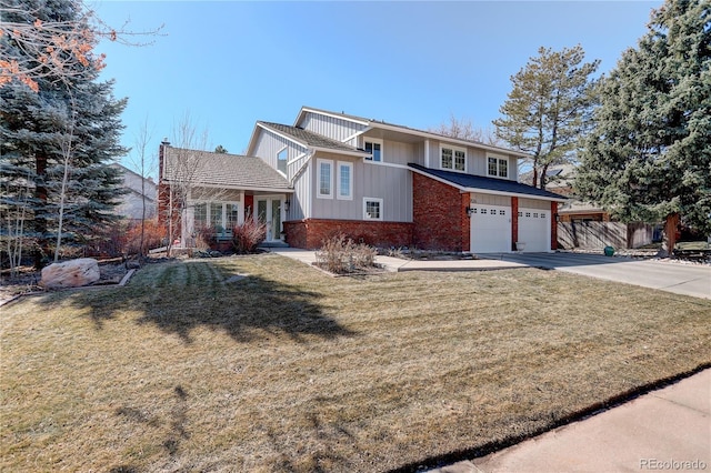 view of front of property with brick siding, concrete driveway, an attached garage, fence, and a front lawn