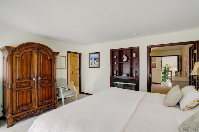 bedroom featuring carpet floors and baseboards