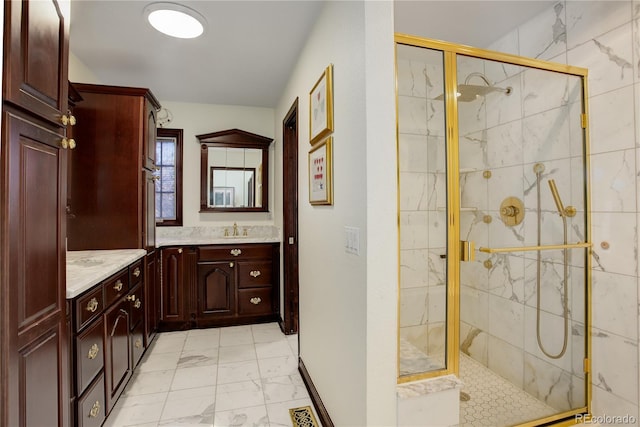 bathroom featuring marble finish floor, visible vents, a shower stall, and vanity