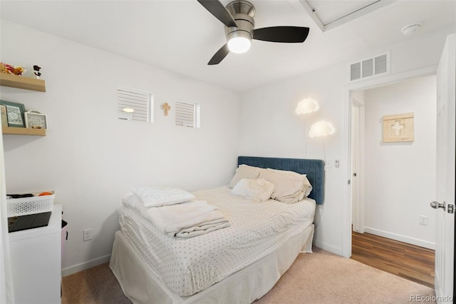 bedroom featuring visible vents, baseboards, and a ceiling fan