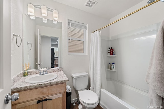 full bathroom with vanity, toilet, shower / bath combo, and visible vents