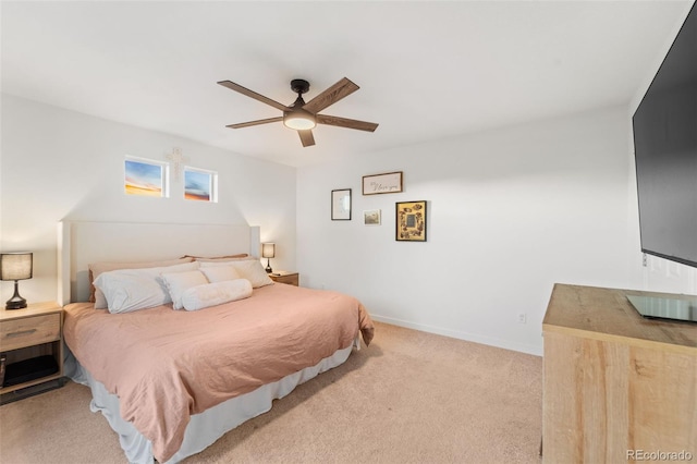 bedroom with baseboards, light colored carpet, and ceiling fan