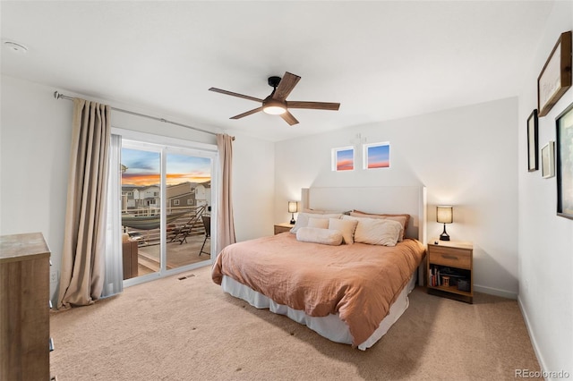 bedroom featuring access to outside, visible vents, baseboards, and carpet floors