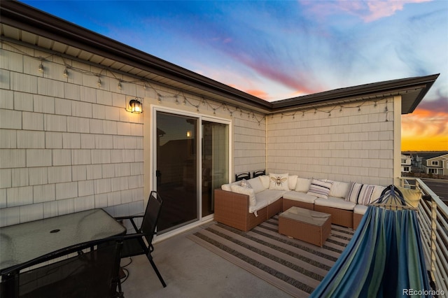 patio terrace at dusk with an outdoor living space