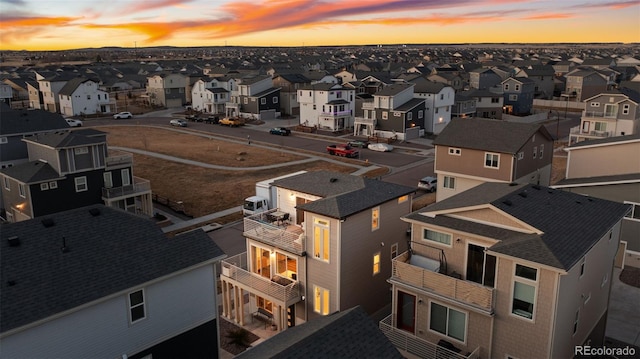 aerial view at dusk with a residential view