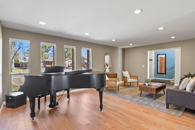 sitting room featuring recessed lighting, light wood-type flooring, and baseboards