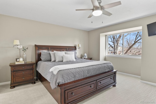 bedroom with baseboards, light carpet, and a ceiling fan