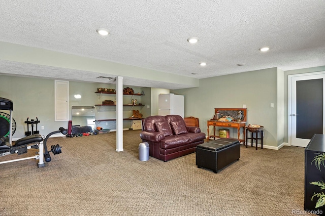 carpeted living area with recessed lighting, baseboards, and a textured ceiling