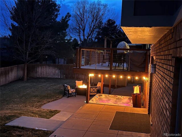 view of patio featuring an outdoor fire pit and a fenced backyard