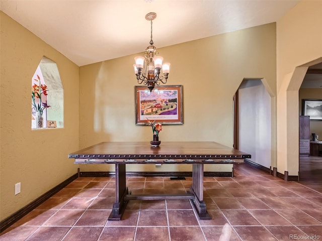 rec room featuring baseboards, arched walkways, vaulted ceiling, and a notable chandelier