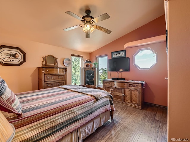 bedroom featuring vaulted ceiling, ceiling fan, and wood finished floors