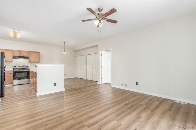 12931 Lafayette St Unit G, Thornton, CO 80241 - unfurnished living room with ceiling fan and light wood-style floors