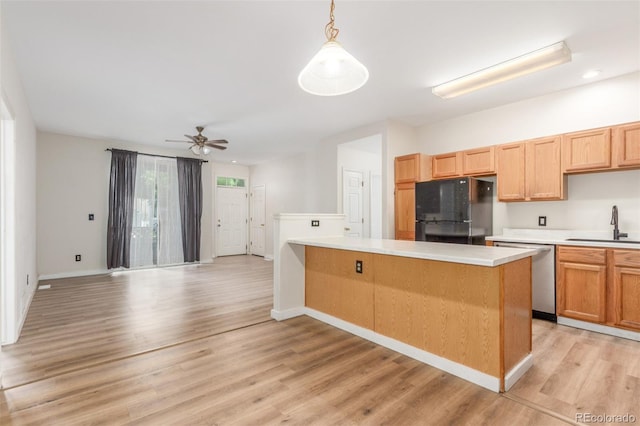12931 Lafayette St Unit G, Thornton, CO 80241 - kitchen with dishwasher, freestanding refrigerator, light wood-style floors, light countertops, and a ceiling fan