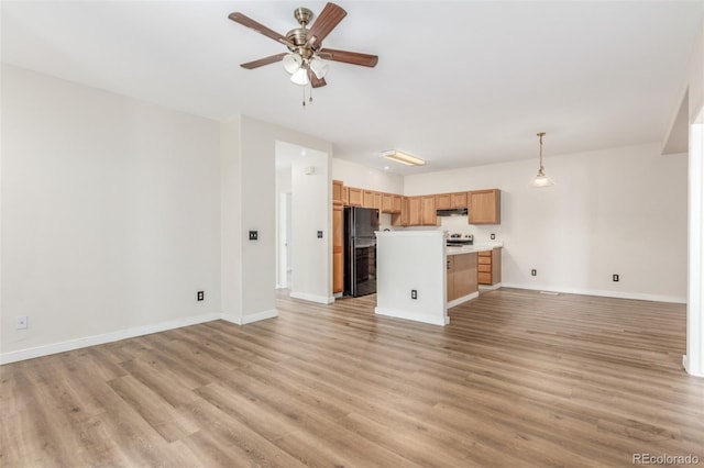 12931 Lafayette St Unit G, Thornton, CO 80241 - unfurnished living room with light wood-type flooring and a ceiling fan