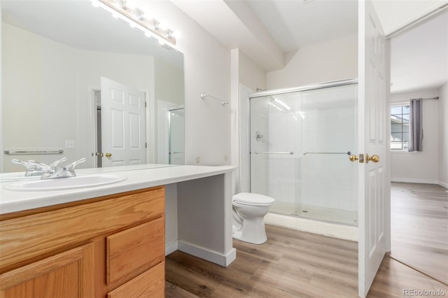 12931 Lafayette St Unit G, Thornton, CO 80241 - full bath featuring vanity, wood finished floors, and a stall shower