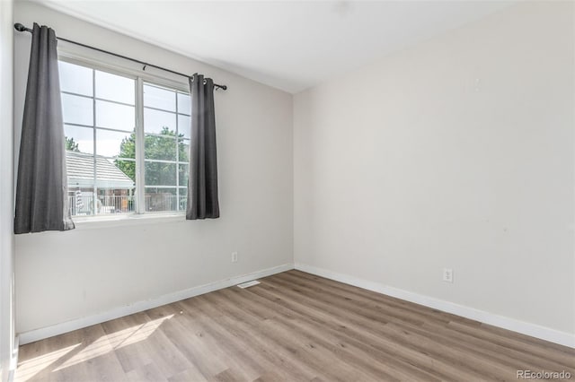 12931 Lafayette St Unit G, Thornton, CO 80241 - empty room with wood finished floors and baseboards