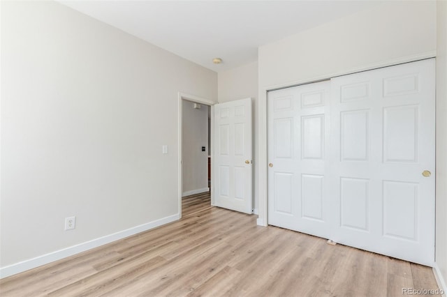 12931 Lafayette St Unit G, Thornton, CO 80241 - unfurnished bedroom with light wood-style floors and a closet