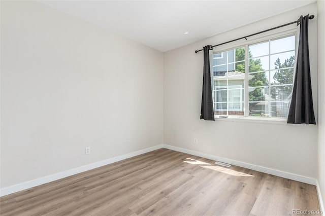 12931 Lafayette St Unit G, Thornton, CO 80241 - empty room with baseboards and light wood-style flooring