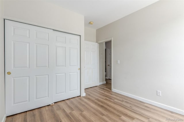 12931 Lafayette St Unit G, Thornton, CO 80241 - unfurnished bedroom with light wood-style flooring and a closet