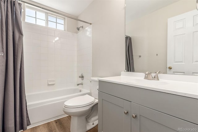12931 Lafayette St Unit G, Thornton, CO 80241 - full bathroom featuring vanity, shower / tub combo, and wood finished floors