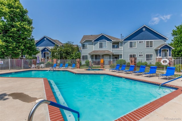 12931 Lafayette St Unit G, Thornton, CO 80241 - community pool featuring a hot tub and a patio
