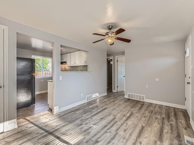 1731 Uinta St, Denver, CO 80220 - unfurnished living room with ceiling fan and wood finished floors