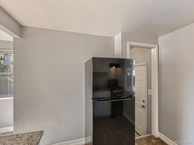 1731 Uinta St, Denver, CO 80220 - kitchen featuring freestanding refrigerator and baseboards