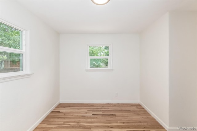 1780 Alton St, Aurora, CO 80010 - empty room with healthy amount of natural light and light wood-style floors