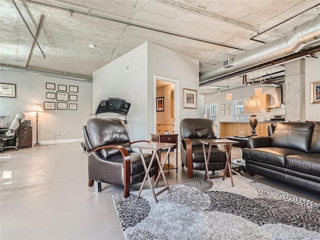 living room featuring concrete flooring