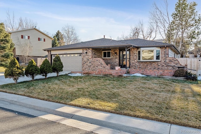 view of front of property with a garage and a front yard